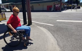 Wheelchair user Lisa Neil prepares to venture across Reefton's main drag:SH7 aka Broadway.