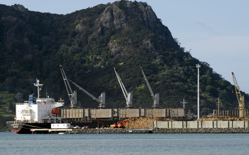 WHANGAREI,NZ - Ship, wood logs and cranes in Northport