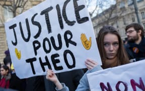 A rally in Paris against police violence when they arrested a young man called Theo in early February.