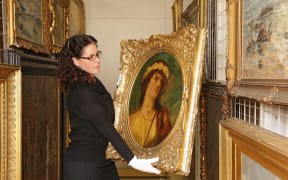 Curator of Collections, Jennifer Taylor Moore, assessing William Etty’s oil on canvas ‘Head of a Young Girl’, 1962/2/1, for the exhibition Revealed