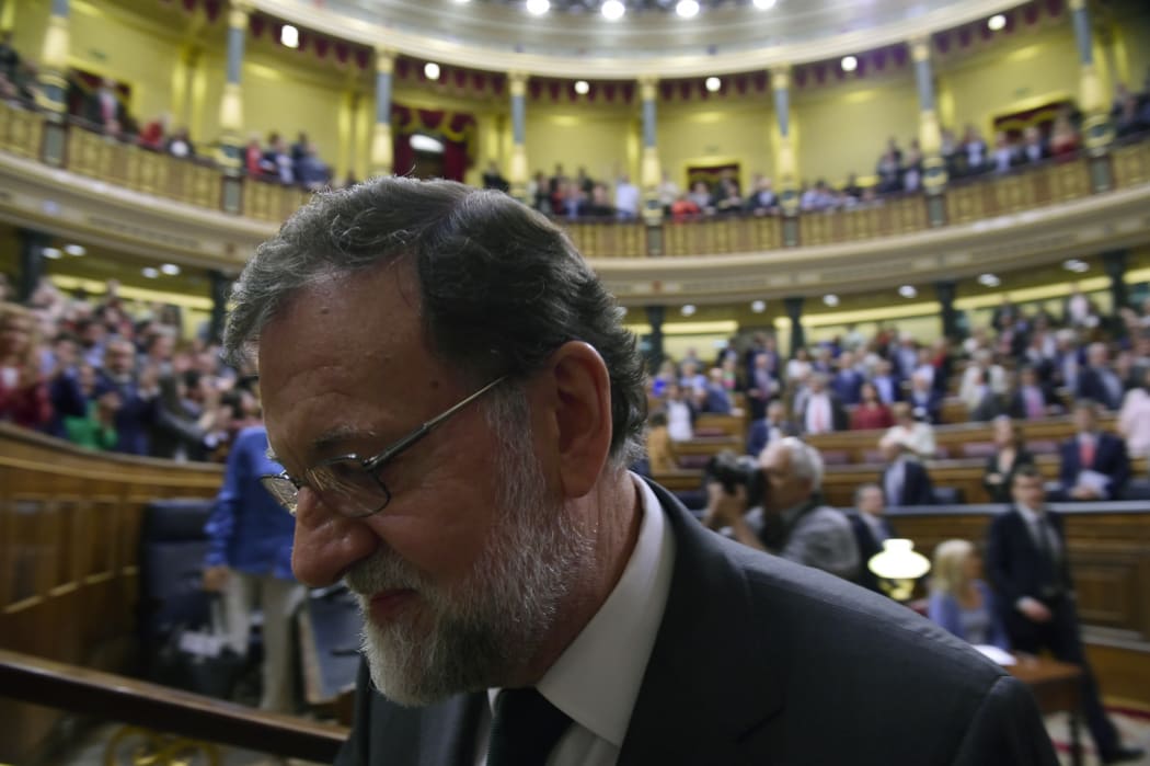 Spain's out-going Prime Minister Mariano Rajoy leaves after a vote on a no-confidence motion at the Lower House of the Spanish Parliament in Madrid on June 01, 2018.