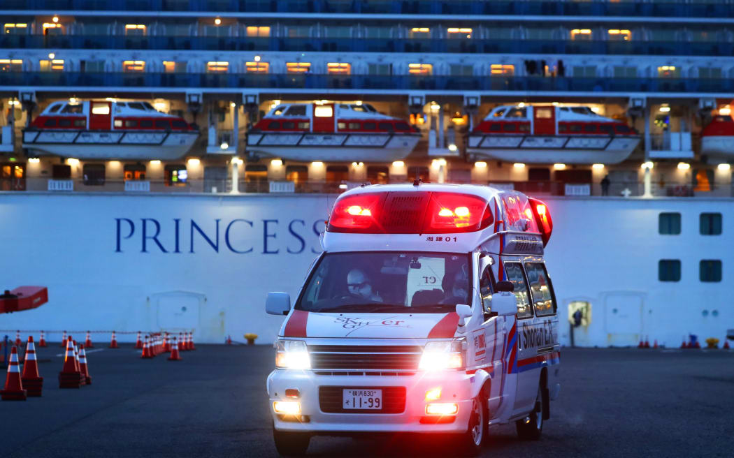 Patients who are on board the Princess Diamond and who have been found to test positive for the novel coronavirus are taken to an ambulance.