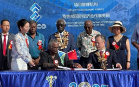Solomon Islands Prime Minister Manasseh Sogavare (back centre) at the handover ceremony with Chinese Ambassador to Solomon Islands Li Ming