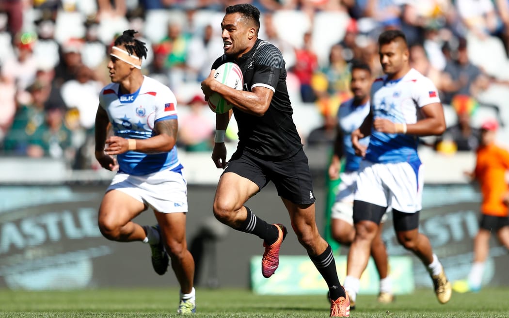 New Zealand's Sione Molia runs in to score against Samoa in Cape Town.
