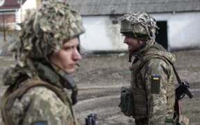 Ukrainian servicemen are seen at a position on the front line with Russia-backed separatists near the town of Schastia, near the eastern Ukraine city of Lugansk, on February 23, 2022.