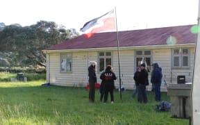 Mau Whenua supporters fly the Tino Rangatiratanga flag at an occupation of Wellington's Shelly Bay.