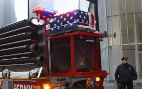 One of the caskets carrying the remains of those killed the September 11, attacks sits is returned to Ground Zero in New York.
