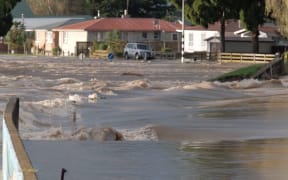 Floodwaters in the evacuated Bay of Plenty town are so deep, boats are the only way around.