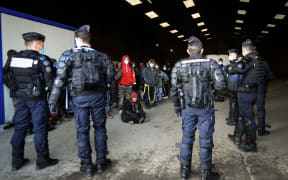 French gendarmes break up an illegal rave that around 2,500 took part in near a disused hangar in Lieuron, France..