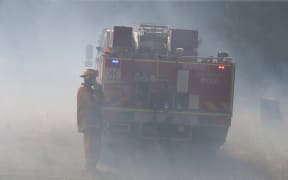 Firefighters battle a bushfire near Wandin, east of Melbourne, in December 2015.