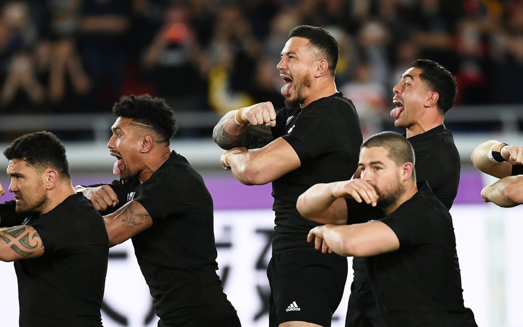 Sonny Bill Williams and team mates perform the haka against England in the Rugby World Cup.