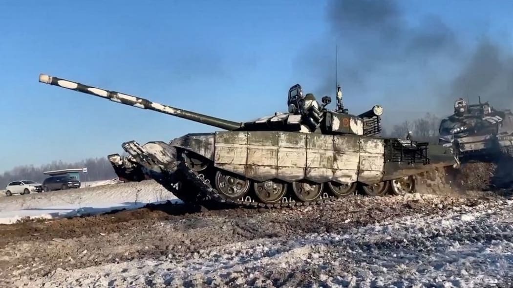 Image grab from footage released on Tuesday Feb 15, 2022 by Moscow shows tanks from the units of the Western Military District are returning to their points of permanent deployment (bases) from undisclosed location near Ukraine.