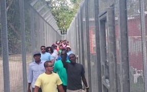 Refugees gather for the 60th day of protest on Manus Island.