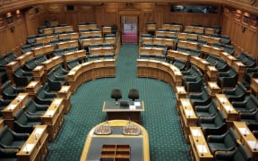 Seats in the empty debating chamber at Parliament