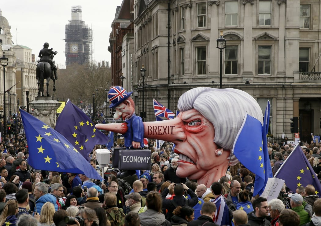An effigy of British Prime Minister Theresa May is wheeled through Trafalgar Square during a Peoples Vote anti-Brexit march in London, Saturday, March 23, 2019.