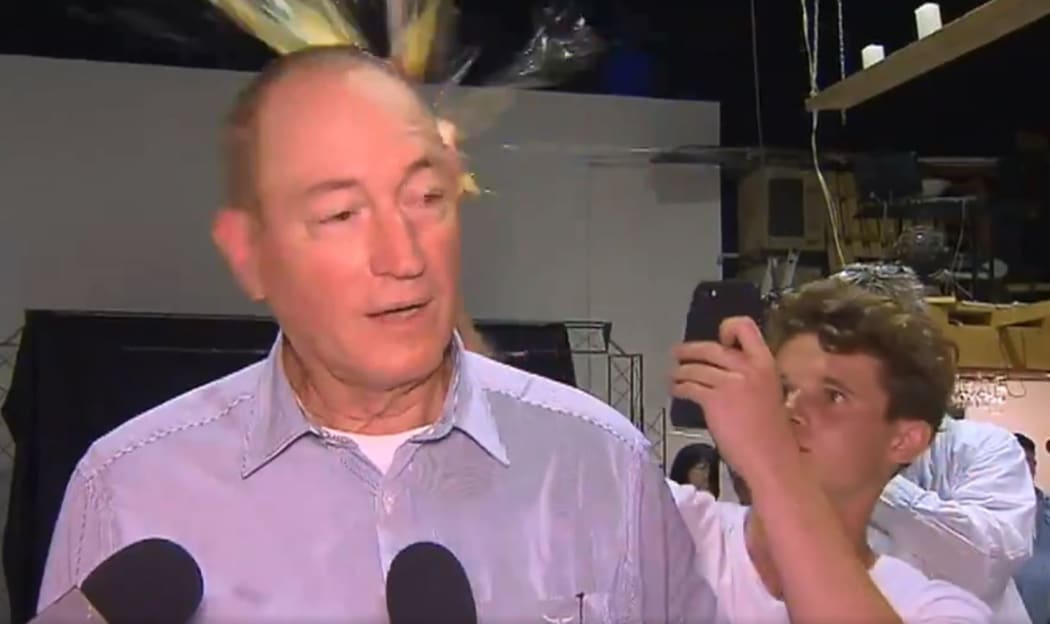 The moment a young man broke an egg on Australian Senator Fraser Anning's head.