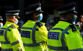 Police officers at an Extinction Rebellion protest in London, Britain, 23 August 2021. Climate action group Extinction Rebellion (XR) are planning to hold multiple actions over two weeks from August 23rd 2021