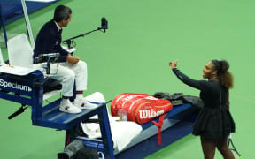 Serena Williams argues with chair umpire Carlos Ramos while playing Naomi Osaka during their 2018 US Open women's singles final match.