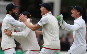 England's Moeen Ali (left) celebrates catching New Zealand's Trent Boult to win the first Test at Lord's Cricket Ground.