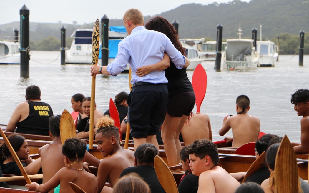 Prime Minister Chris Hipkins, who was wearing formal attire after meeting with Iwi chairs, rolled up his suit pants to join rangatahi who were waka training at Waitangi on 3 February, 2023.