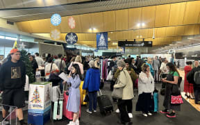 Hundreds of people queue at Wellington Airport ahead of travel disruptions to rebook their flights after more than 50 flights in and out of the capita were cancelled due to low lying cloud.