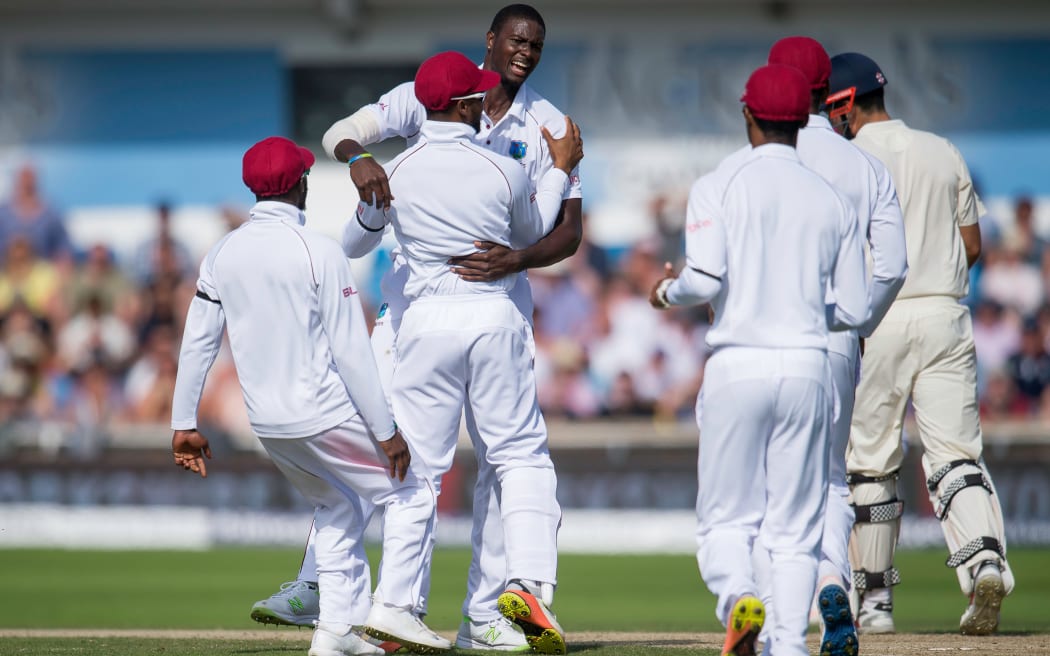 West Indies celebrate Alistair Cook's wicket