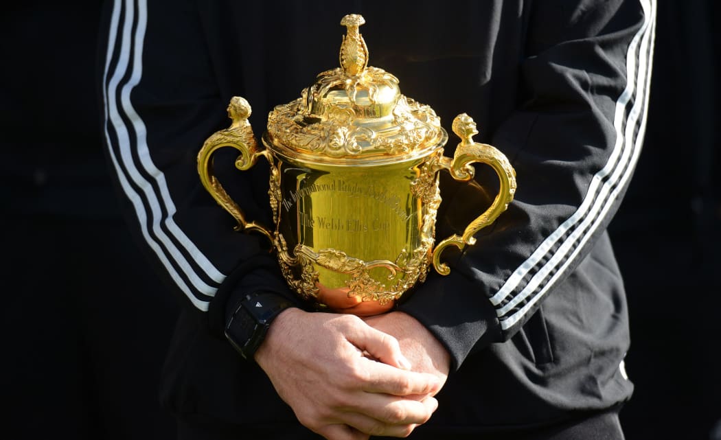 The All Blacks captain Richie McCaw holds the Rugby World Cup. (The Webb Ellis Trophy).