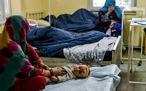 A child is treated inside a hospital in the city of Sharan for injuries in an earthquake in Gayan district, Paktika province on 22 Jun 2022.