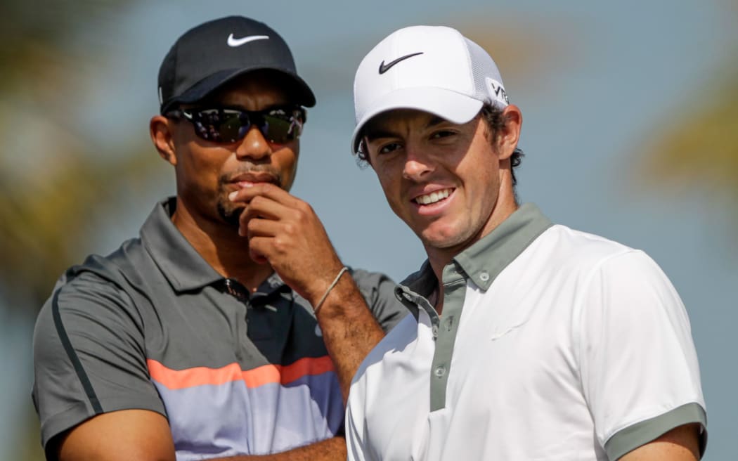 Tiger Woods (L) with Rory McIlroy
