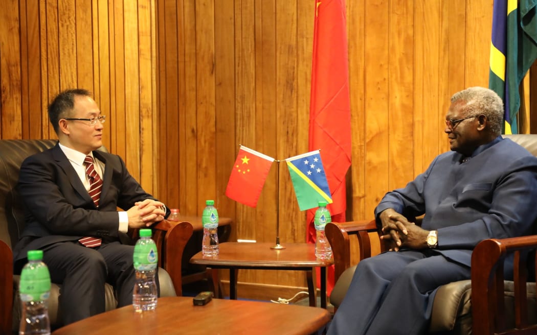 Solomon Islands prime minister Manasseh Sogavare (right) with Li Ming, China's first ambassador to the Solomon Islands.