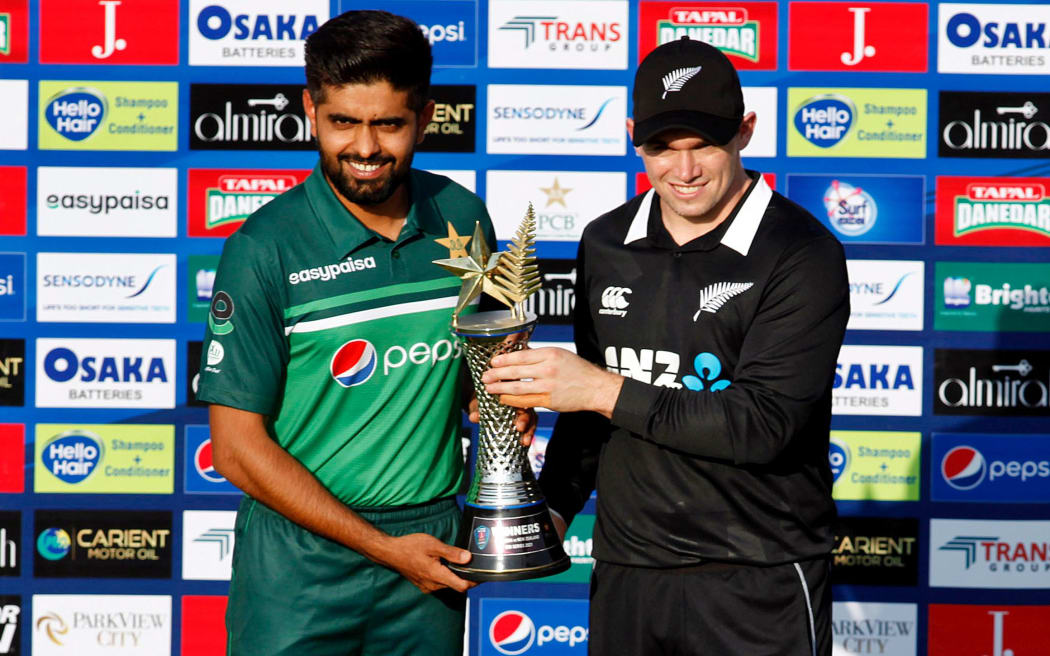 Pakistan cricket captain Babar Azam and New Zealand captain Tom Latham hold the trophy the two sides were supposed to compete for in the one day series which was abandoned.