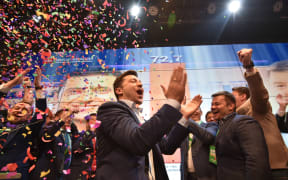 Ukrainian comedian and presidential candidate Volodymyr Zelensky reacts after the announcement of the first exit poll results in the second round of Ukraine's presidential election at his campaign headquarters in Kiev on April 21, 2019. (Photo by Genya SAVILOV / AFP)