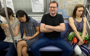Women crowded by 'Manspreading' on a New York Subway.