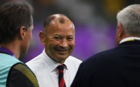 England's head coach Eddie Jones (C) smiles during a warm-up session before the Japan 2019 Rugby World Cup quarter-final match between England and Australia at the Oita Stadium in Oita on October 19, 2019. (Photo by CHARLY TRIBALLEAU / AFP)