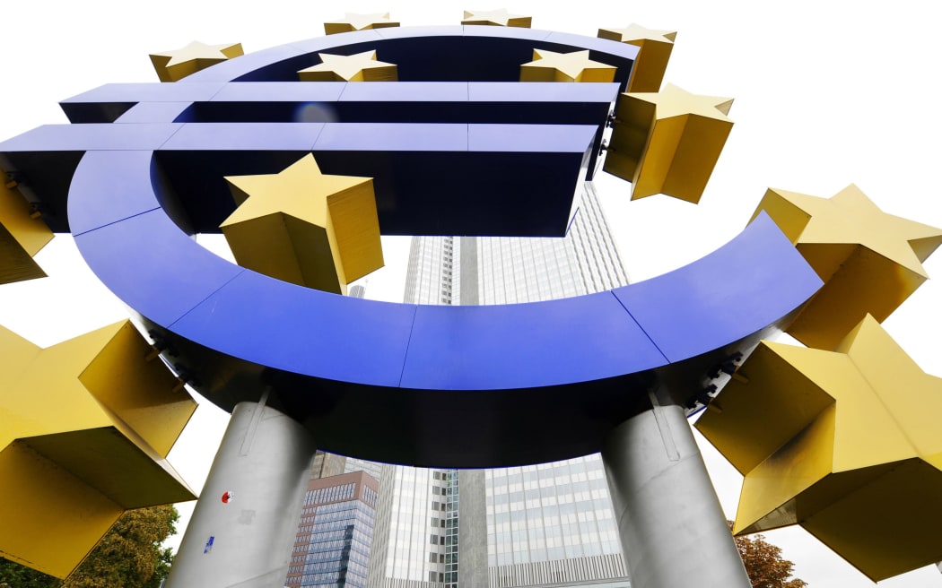 Symbol of the euro outside the headquarters of the European Central Bank, Germany.
