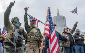 Armed supporters of President Trump chant during a protest on 6 January 2021 in Salem, Oregon.