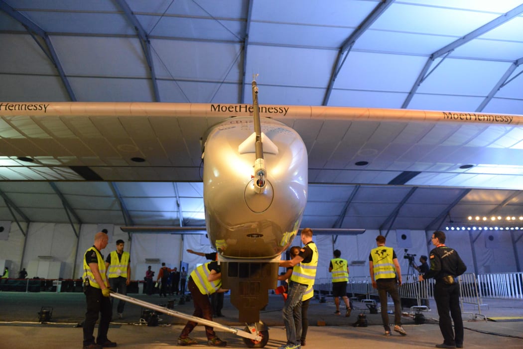 Ground crew members inspect Solar Impulse 2 at Sardar Vallabhbhai Patel International Airport.