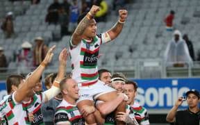 Isaac Luke is lifted by his Rabbitohs team-mates after their win at the NRL Auckland Nines.