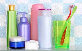 A collection of personal hygiene and body care products, including toothpaste, soap and body wash.