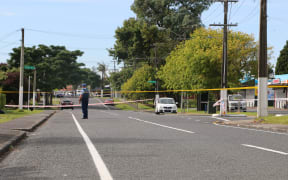 Police guard the scene where a man died early Sunday morning