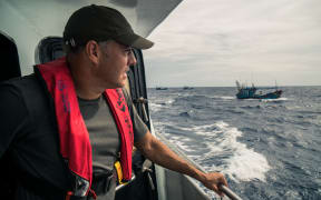 Ian Urbina on an Indonesian patrol ship  chasing Vietnamese fishing ships in a contested area of the South China Sea