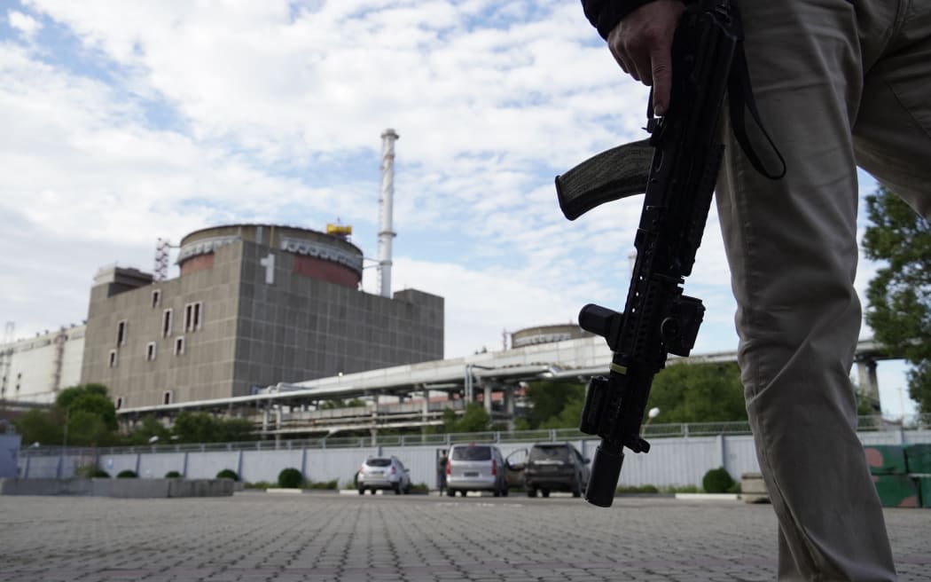 A security guard stands in front of the Zaporizhzhia Nuclear Power Plant, on 11 September. The facility in south east Ukraine is the largest nuclear power plant in Europe and among the 10 largest in the world.