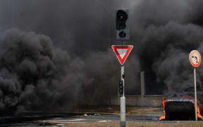 Tyres are set on fire during protests in New Caledonia's capital, Noumea