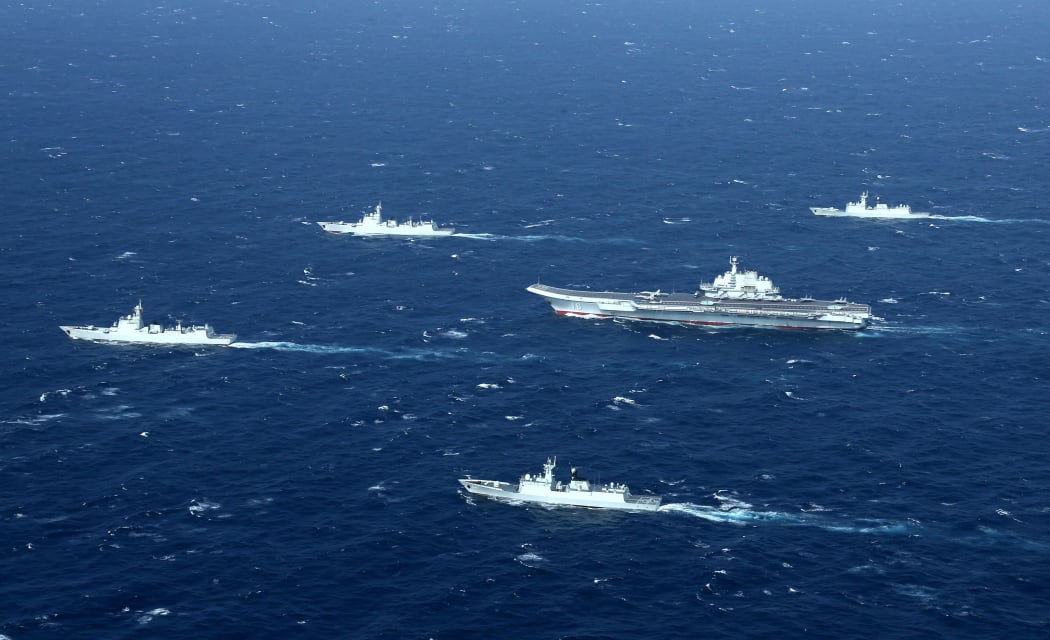 A Chinese Navy formation, including the aircraft carrier Liaoning (C), during military drills in the South China Sea on January 2, 2017.