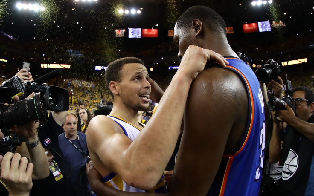 Golden State's MVP Steph Curry speaks with Kevin Durant after the Warriors' 96-88 win in Game Seven of the Western Conference Finals during the 2016 NBA Playoffs in Oakland. Ezra Shaw/Getty Images/AFP 
EZRA SHAW / GETTY IMAGES NORTH AMERICA / AFP