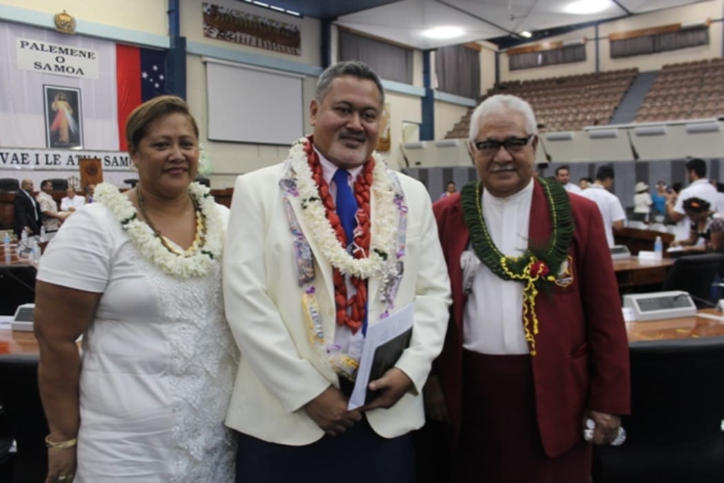 Samoa's Justice minister, Faaolesa Katopau Ainuu, (centre) with his wife Diana and the mayor of Apia.
