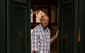 Bill Culbert in the doorway of the New Zealand pavilion in Venice.