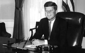 President John F Kennedy in the Oval Office of the White House.