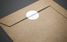 Yellow envelope with blank sticker on it