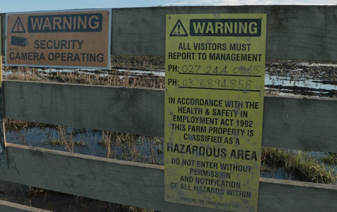 A warning sign on the gate of one of the infected farms.